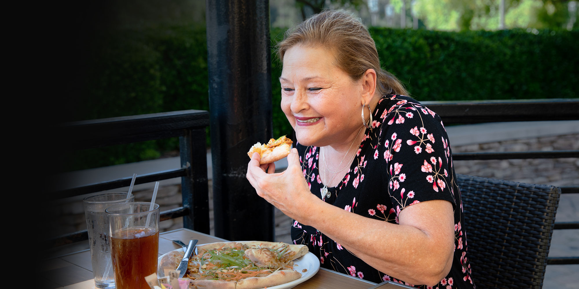 dental implant patient eating pizza